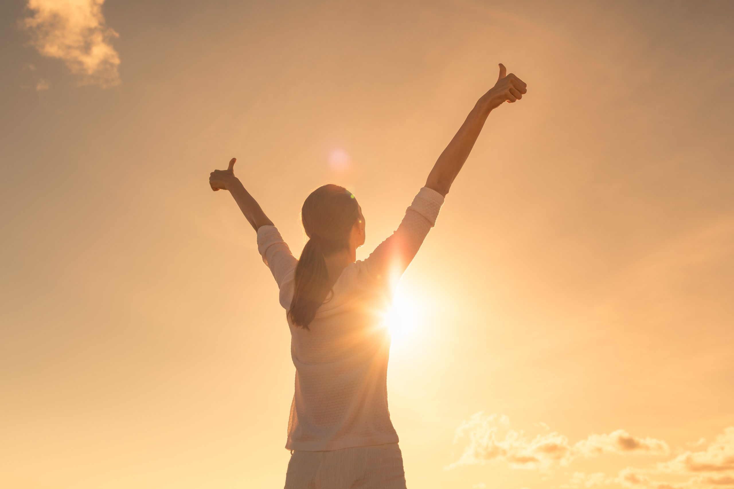 Woman feeling, positive, joyful, inspired, and optimistic.